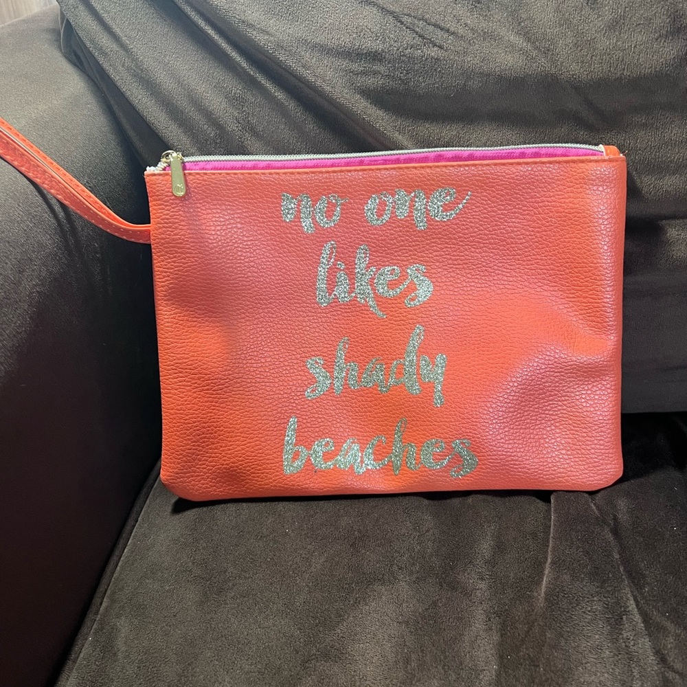 Cosmetic zippered bag. Great to throw in your beach bag or take to the pool